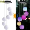 Solar Crystal Ball Wind Chime with LED color-changing lights, perfect for garden decor and outdoor l.