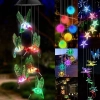 Hummingbird wind chime with LED color-changing solar-powered balls, perfect for garden decor and out.