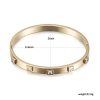 Gold metal hinged bangle with square clear stones, 2.4 to 2-inch diameter.
