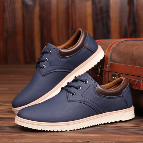 Stylish men's casual leather shoes with brown accents and white soles.