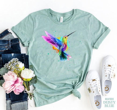 Vibrant hummingbird graphic T-shirt in pastel green for women.