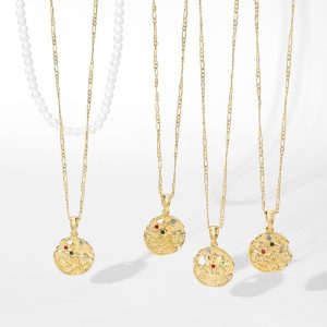 Gold zodiac sign pendant necklaces with delicate chains on white background.