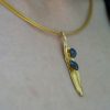 Elegant olive leaf necklace with black druzy stones in gold brass and black rhodium.